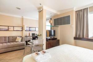 TV a/nebo společenská místnost v ubytování FLAT PRIME II REGIÃO DA PAULISTA JARDINS