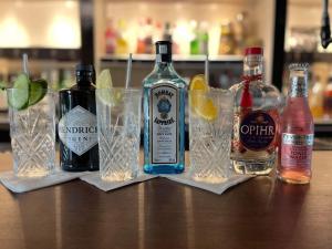 a group of alcohol bottles and glasses on a table at Cross Keys Inn in Penrith +13 photos