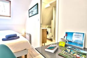 Telewizja i/lub zestaw kina domowego w obiekcie Ty Koant au coeur du Guilvinec - Wifi inclus - Draps et serviettes inclus