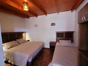 Cama ou camas em um quarto em Lalck Cketi Hospedaje y Turismo