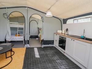 an interior view of a kitchen and dining area in a rv at The Heron in Rhayader