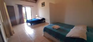 Letto o letti in una camera di Hosteria Guachapeli