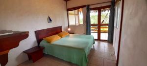 Letto o letti in una camera di Hosteria Guachapeli