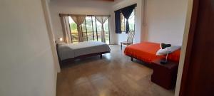 Letto o letti in una camera di Hosteria Guachapeli