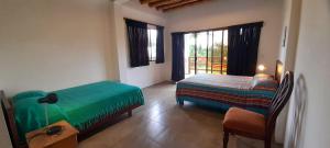 Letto o letti in una camera di Hosteria Guachapeli