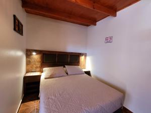 Postel nebo postele na pokoji v ubytování Lalck Cketi Hotelería y Turismo