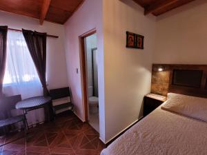 Postel nebo postele na pokoji v ubytování Lalck Cketi Hotelería y Turismo
