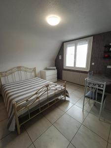 Ένα ή περισσότερα κρεβάτια σε δωμάτιο στο studio 2 personnes entre terre et mer