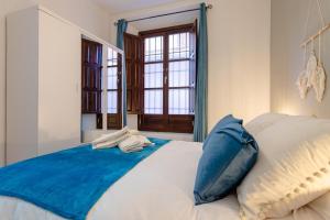 Posteľ alebo postele v izbe v ubytovaní Boutique Apartment Center Granada