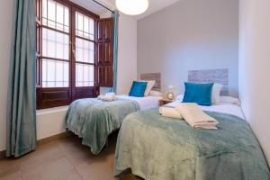 Posteľ alebo postele v izbe v ubytovaní Boutique Apartment Center Granada