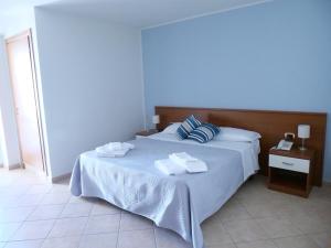 Posteľ alebo postele v izbe v ubytovaní Grand Hostel Calabria