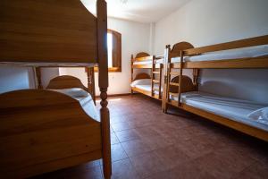a room with a bunch of bunk beds at Albergue del serpis in Lorcha