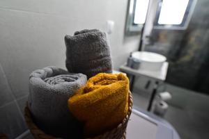 two towels in a basket in a bathroom at FLH - Just 5 in Şelimbăr +14 photos