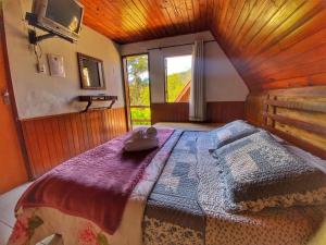 Cama ou camas em um quarto em Pousada Colibri Serrano