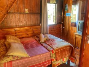 Cama ou camas em um quarto em Pousada Colibri Serrano