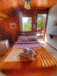 Cama ou camas em um quarto em Pousada Colibri Serrano