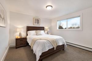 a bedroom with a large bed and a window at Comfortable Abode Near Historic Downtown in Loveland +23 photos