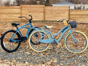 two blue bikes are parked next to each other at Inviting Bungalow Next to UNC - Free Cruiser Bikes in Greeley
