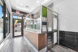 a restaurant with a bar in the middle of a building at Hotel 365 Bronx - Yankee Stadium in Bronx