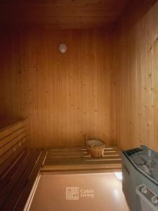 a room of a sauna with a basket in it at Great apartment in Trysil, ski inout, wifi, sauna in Trysil