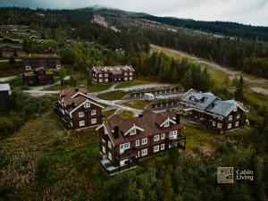 an aerial view of a large house in a forest at Great apartment in Trysil, ski inout, wifi, sauna in Trysil