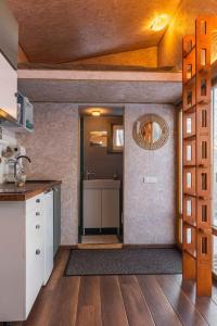 a kitchen with a sink and a counter top at Beautiful Tiny house on the lake side. in Trakai