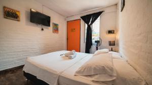 Postel nebo postele na pokoji v ubytování Viajero Hostel Cali & Salsa School