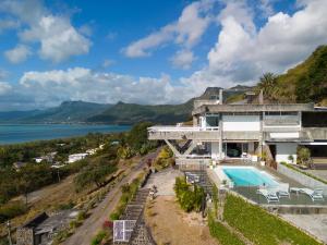 an aerial view of a house with a swimming pool at Villa Cambier by muse villas in Le Morne
