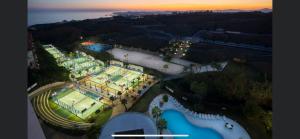 an aerial view of a building with a tennis court at New apartment in Higueron West in Fuengirola