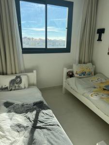 A bed or beds in a room at New apartment in Higueron West Még 23 kép