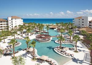 an aerial view of the pool at the excellence punta cana resort at Secrets Playa Mujeres Golf & Spa Resort - All Inclusive Adults Only in Cancún