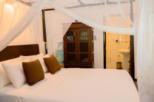 Ένα ή περισσότερα κρεβάτια σε δωμάτιο στο Almayans Bungalow