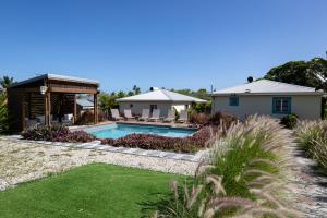 a house with a swimming pool in a yard at Aigue-marine in Sainte-Anne +10 photos