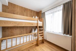 Łóżko lub łóżka w pokoju w obiekcie Apartments Untersüßgut Eben