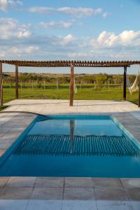 a swimming pool in the middle of a patio at Estancia San Agustin in Curuzú Cuatiá