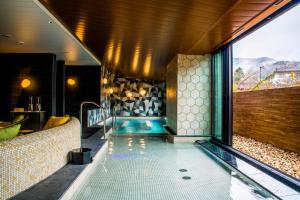 a pool in the middle of a house at Hotel Indigo Hakone Gora by IHG in Hakone