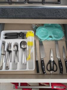 a drawer filled with utensils in a kitchen at Luxury departament Centenario in Guadalajara