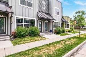 a house with a sidewalk in front of it at Spectacular Home near Breweries & River District! in Fort Collins