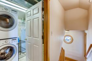 a laundry room with a washer and dryer at Brilliant Posh Home - Backs to Poudre River Trail! in Fort Collins