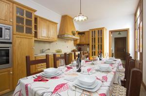 a kitchen with a table with plates and glasses on it at Villa Remedios in Teguise