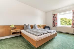Ένα ή περισσότερα κρεβάτια σε δωμάτιο στο Hotel Kniestedter Hof