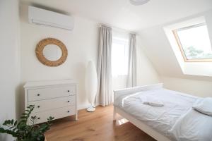 Rúm í herbergi á Dům na jihu Mikulov s finskou saunou