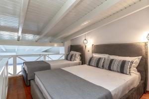 A bed or beds in a room at Pallas Seaside 2