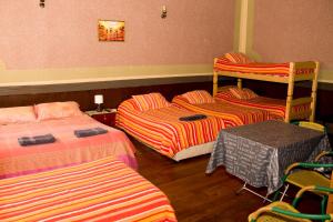 Postel nebo postele na pokoji v ubytování Hostal Residencia Blest Gana