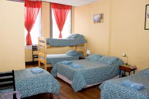 Postel nebo postele na pokoji v ubytování Hostal Residencia Blest Gana