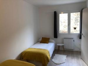 Postel nebo postele na pokoji v ubytování Casita Pelopin