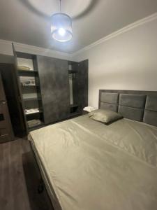 Katil atau katil-katil dalam bilik di 2 Cosy Apartment in townhouse near Airport EVN