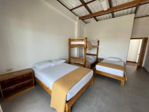 Voodi või voodid majutusasutuse Samana Hostal, Puerto Engabao toas
