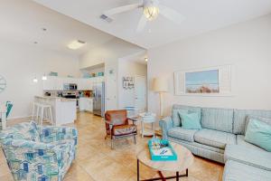 a living room with a couch and a table at Morgan Shores in Port Aransas