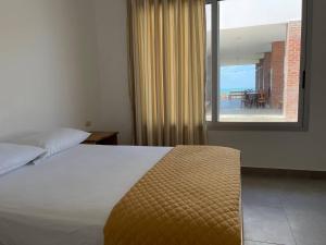Voodi või voodid majutusasutuse Samana Hostal, Puerto Engabao toas